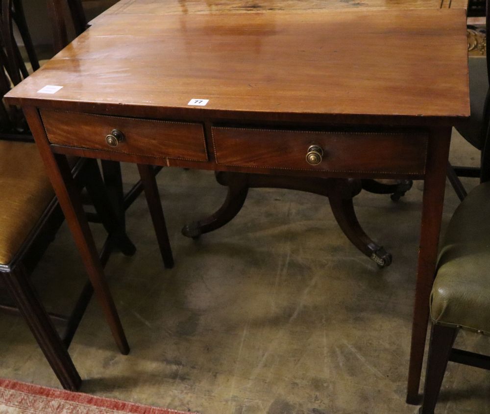 A Georgian inlaid mahogany bow front two drawer side table, width 82cm, depth 45cm, height 78cm